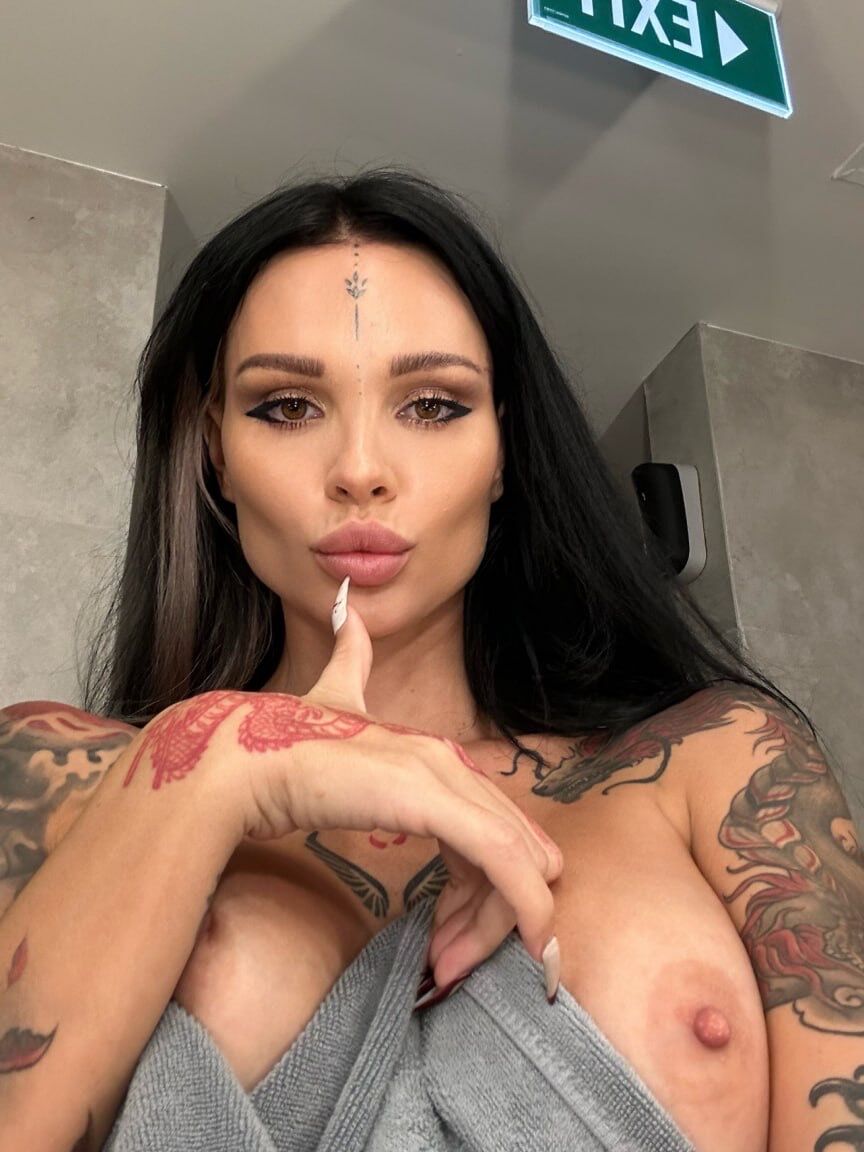 13P Inked OnlyFans model Sunny Free unveils her big tits and ass in a solo