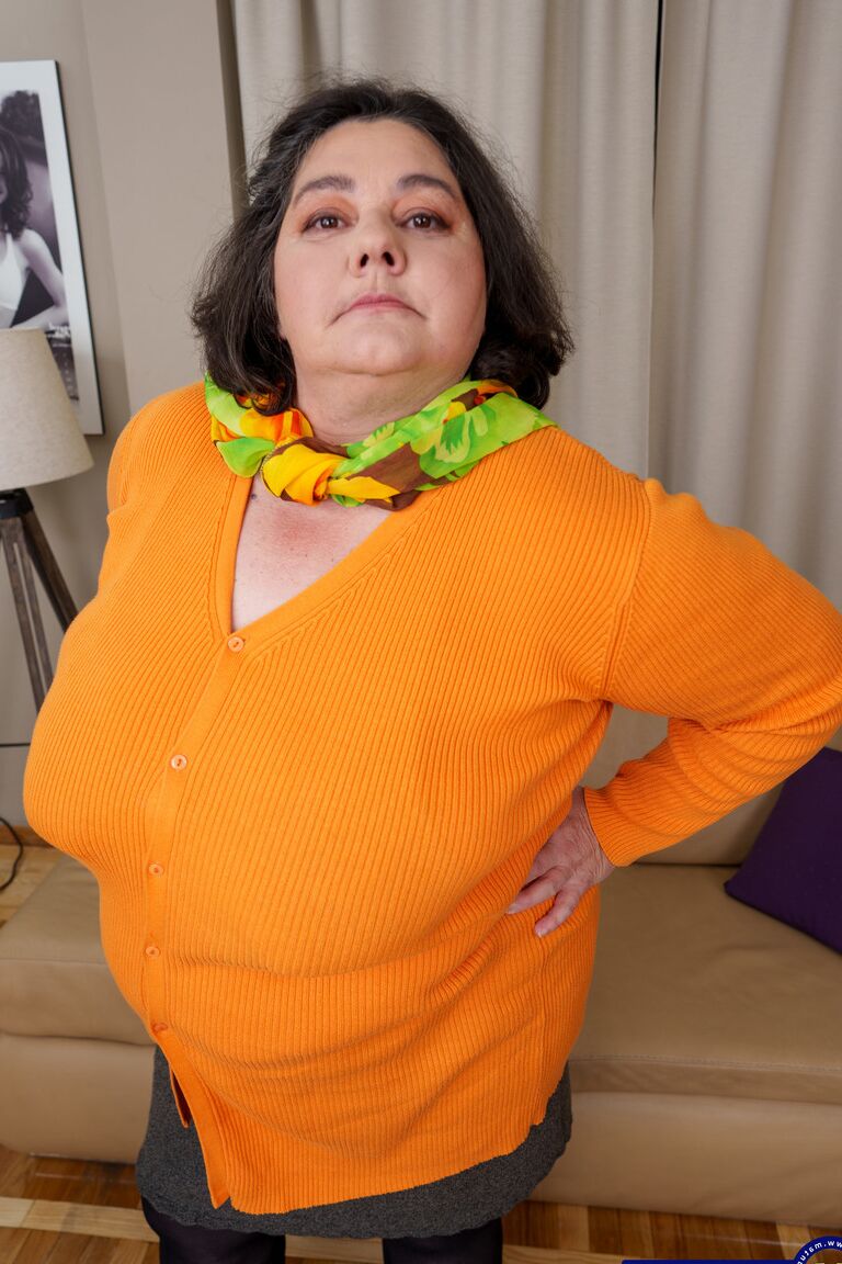 21P Mature fatty Edina flaunts her big booty while teasing in stockings