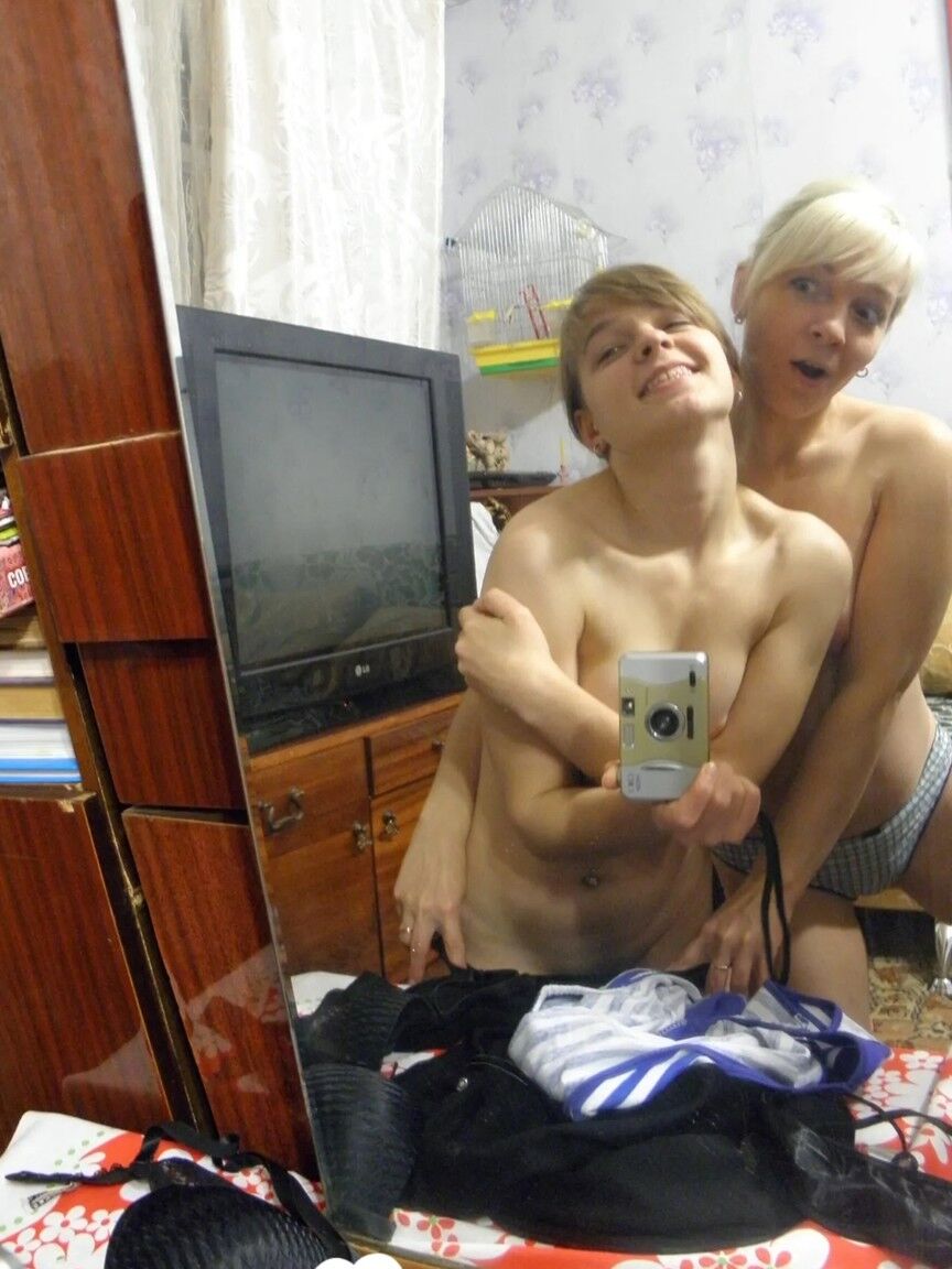 20P Lesbian babes strip and suck each other's tits while taking selfies