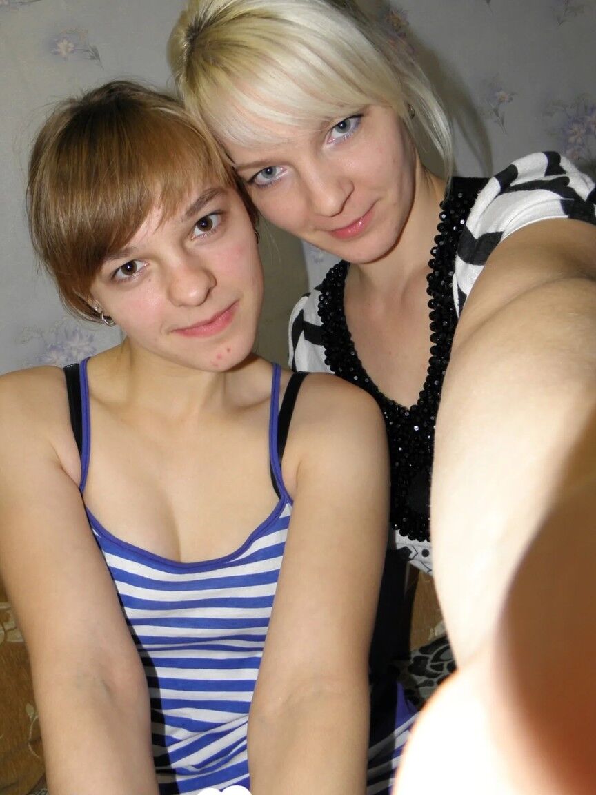 20P Lesbian babes strip and suck each other's tits while taking selfies