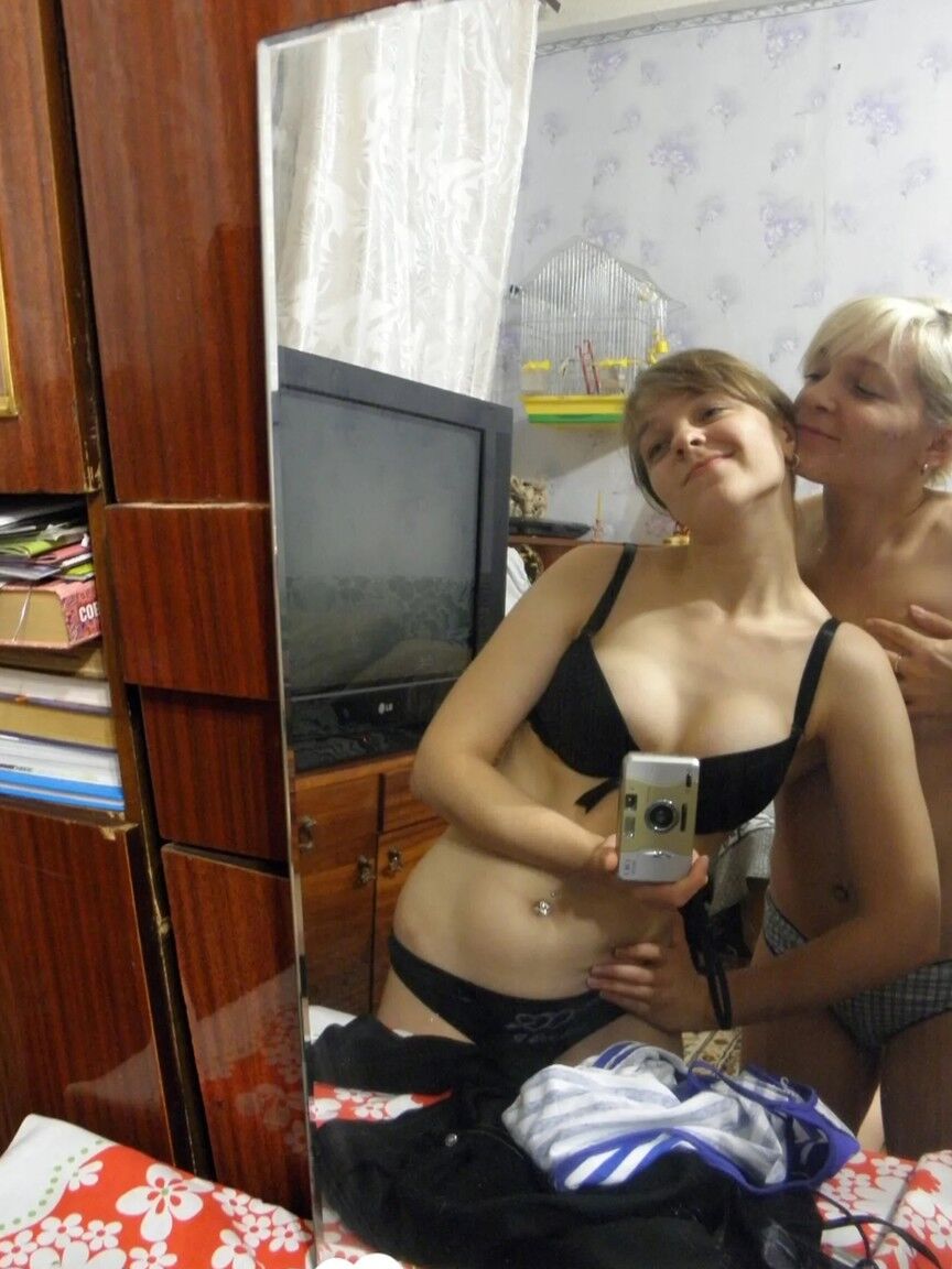 20P Lesbian babes strip and suck each other's tits while taking selfies