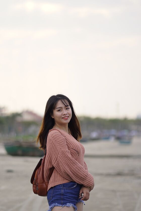 21P Stunning Asian babe poses in her jean shorts & sweater in public