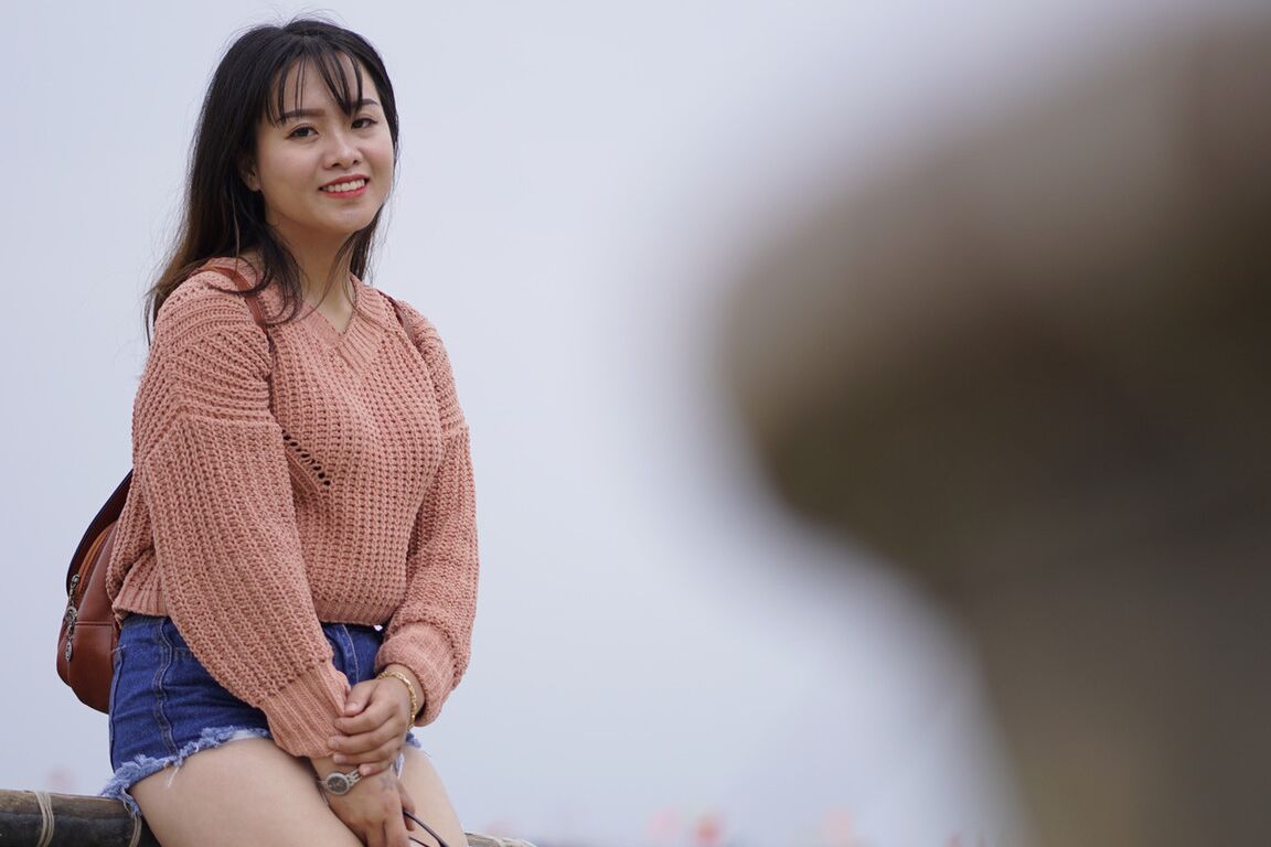 21P Stunning Asian babe poses in her jean shorts & sweater in public