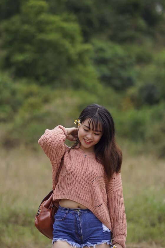 21P Stunning Asian babe poses in her jean shorts & sweater in public