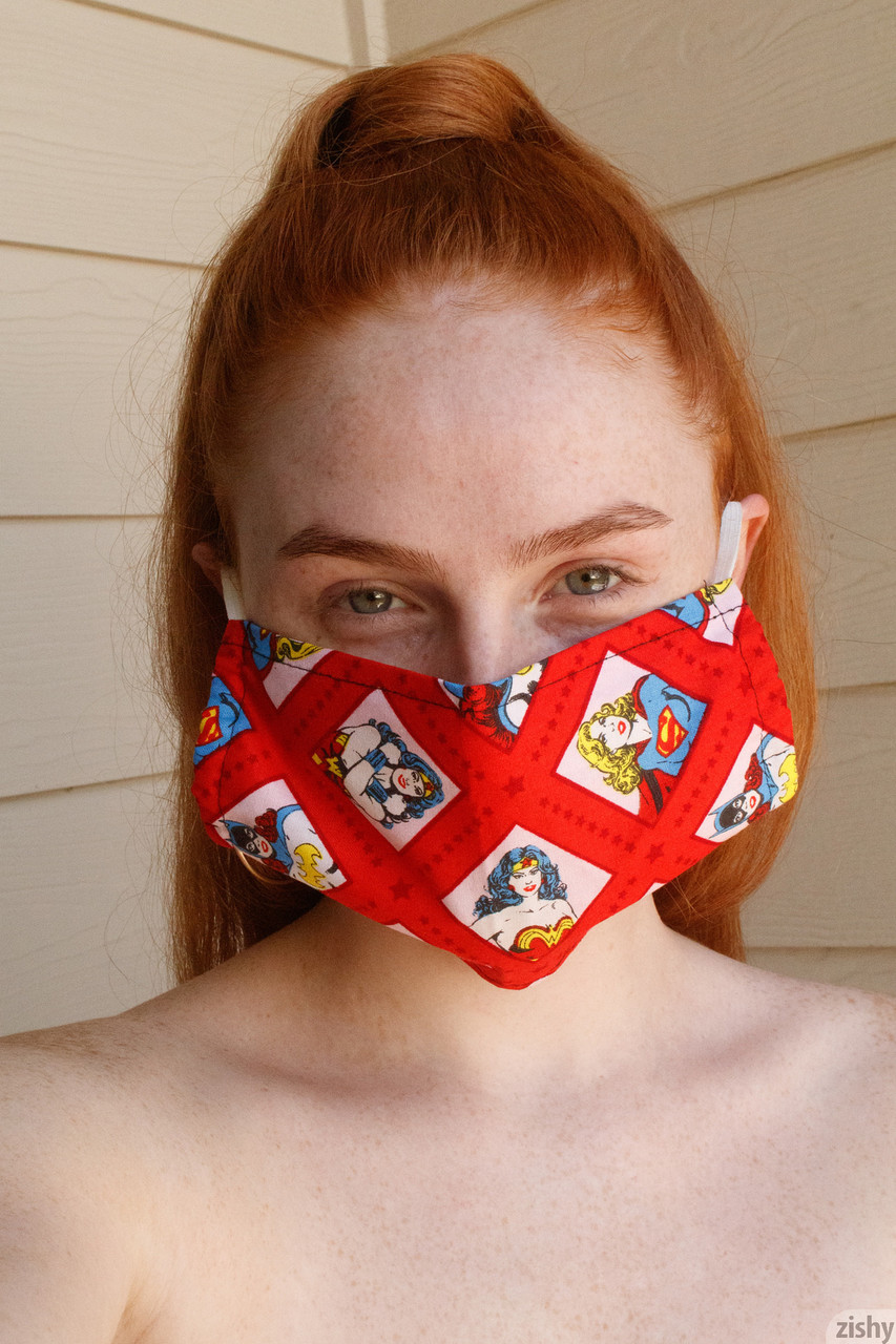 12P Redheaded teen with a freckled face shows her nice big booty in a solo