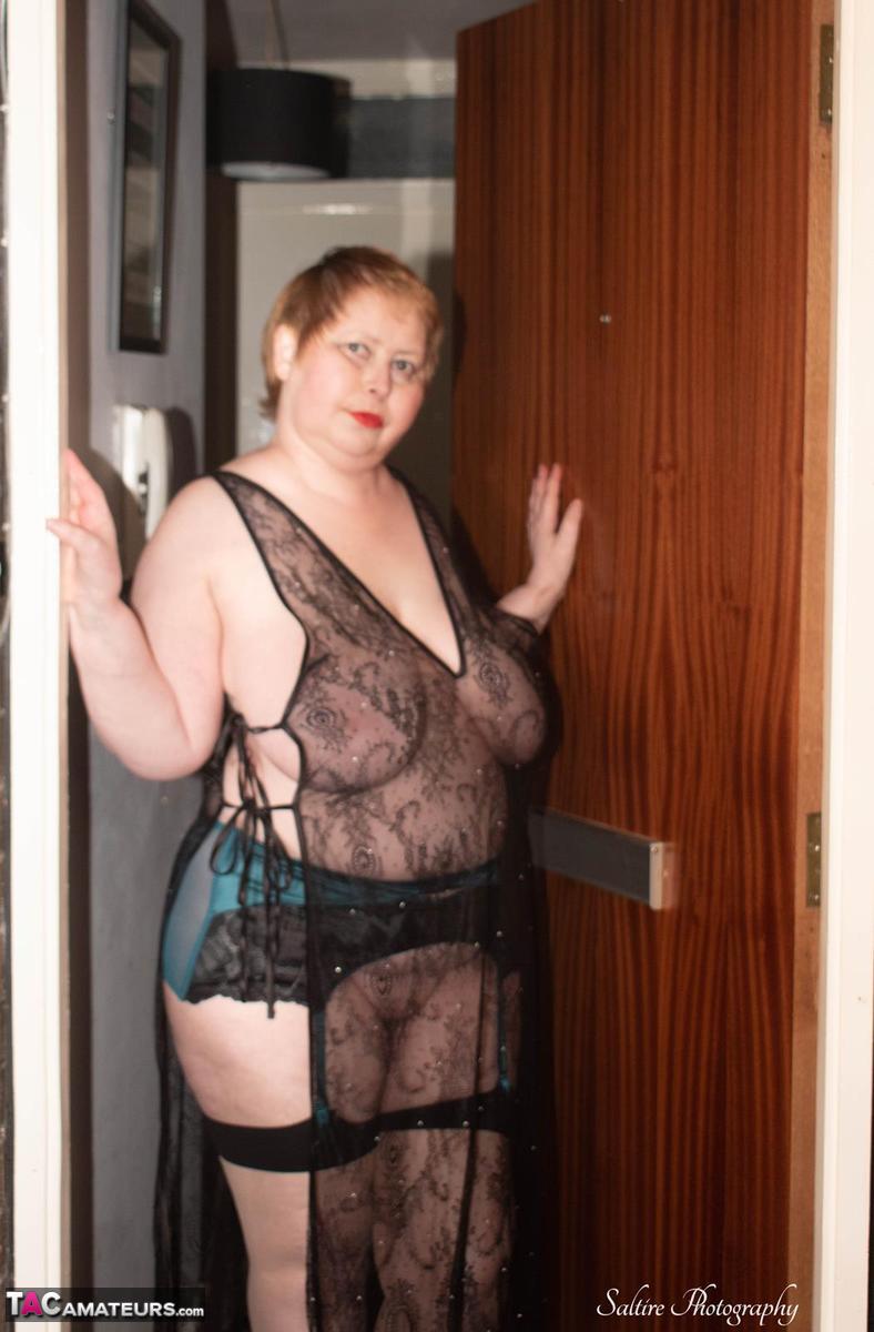 16P Older fatty Posh Sophia plays with her huge boobs while removing lingerie