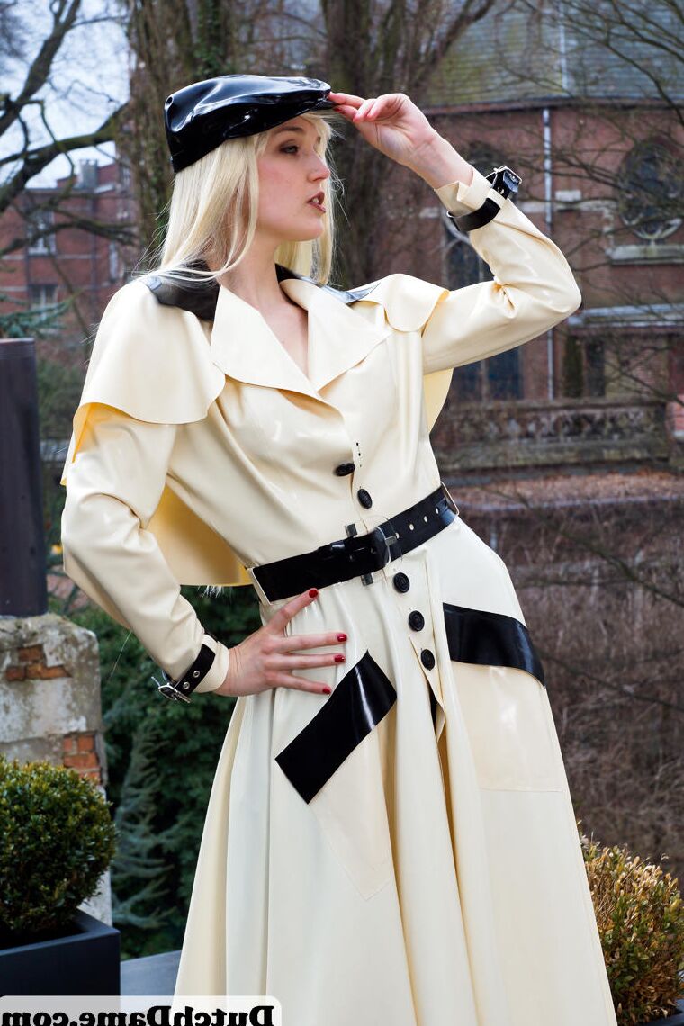 16 Pics Hot blonde flashes latex garters while modeling outdoors in rubber attire