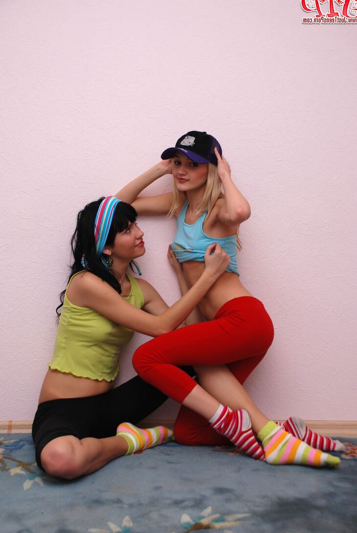 20 Pics Young lesbians hump each other while stripping to their socks