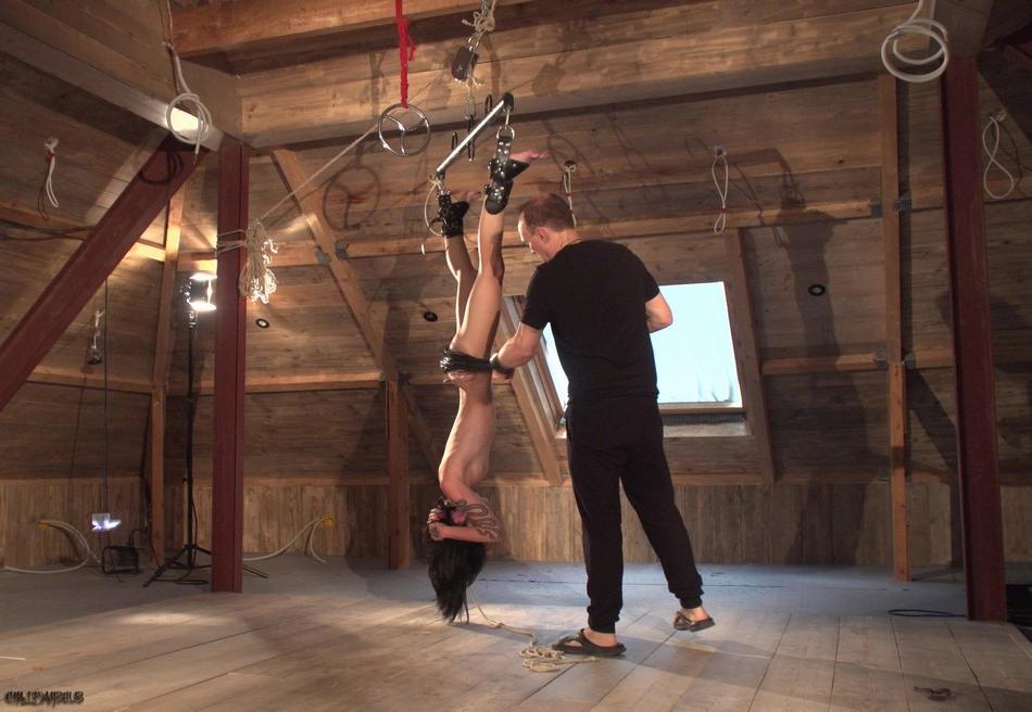 16P Crystal Cherry is suspended upside down in an attic before sex on a mattress