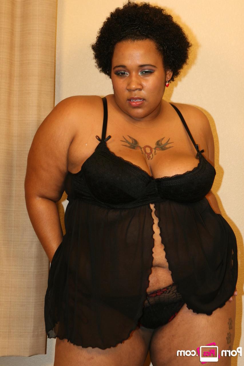 20P Chubby ebony bombshell Kitten shows off her great ass in a sexy striptease