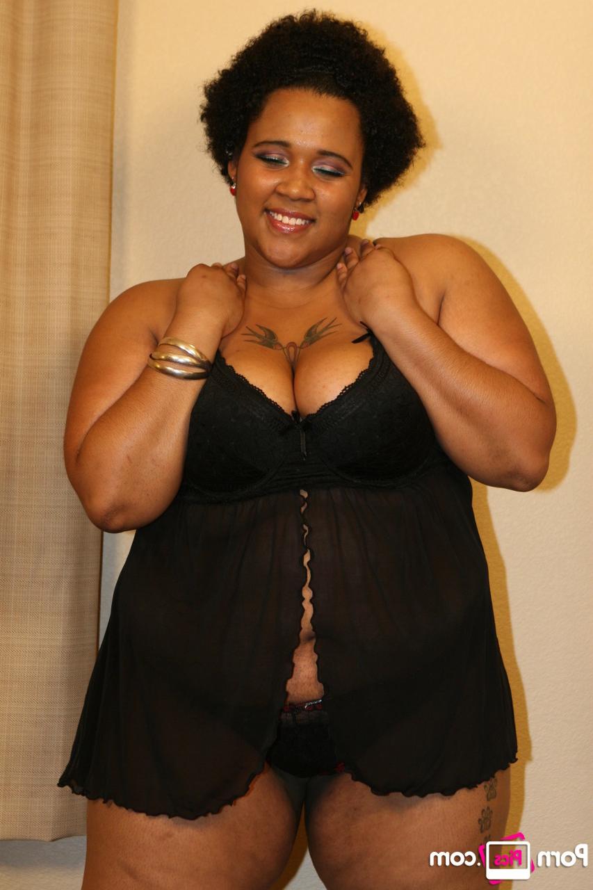 20P Chubby ebony bombshell Kitten shows off her great ass in a sexy striptease