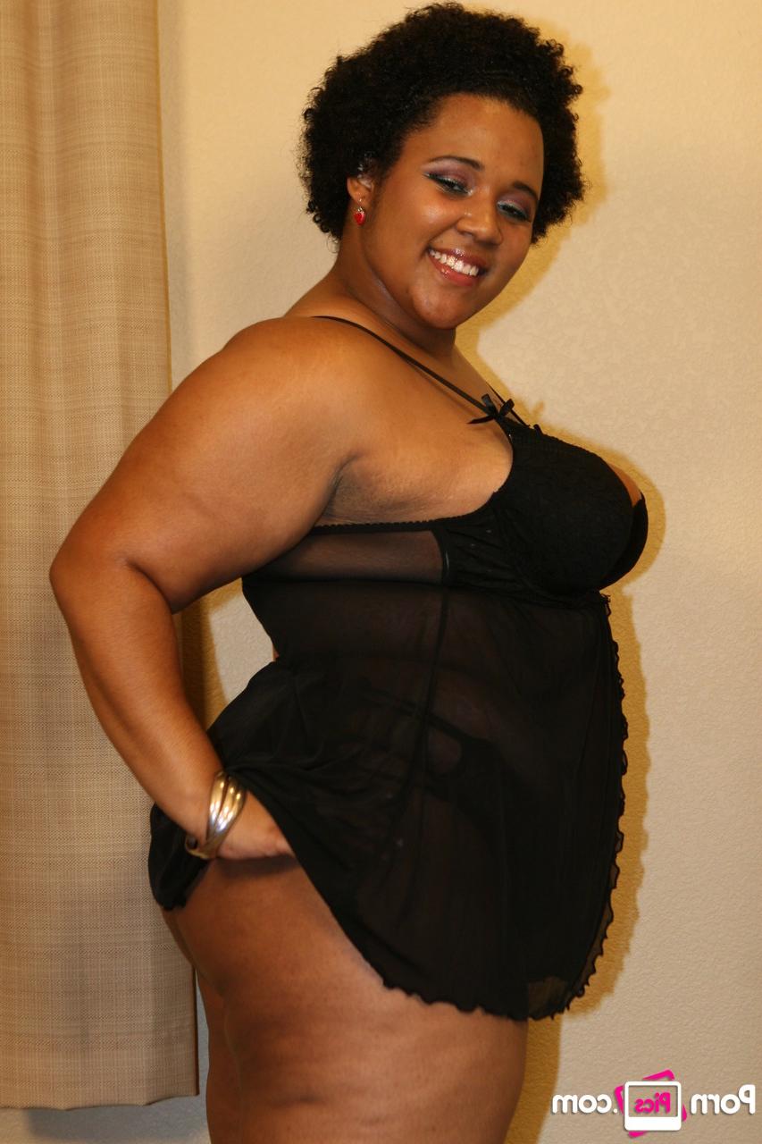20P Chubby ebony bombshell Kitten shows off her great ass in a sexy striptease