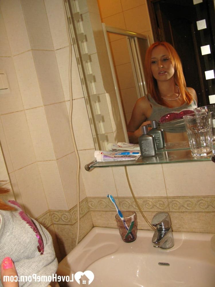 20P Skinny amateur ginger strips in the bathroom and takes a hot shower