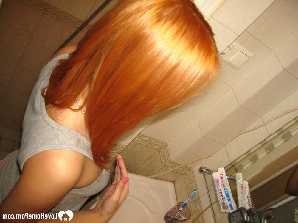 20P Skinny amateur ginger strips in the bathroom and takes a hot shower