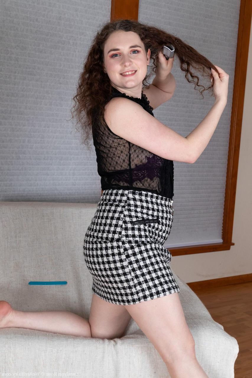20P Curly-haired American Caralynn Rose undresses & rubs her furry vagina