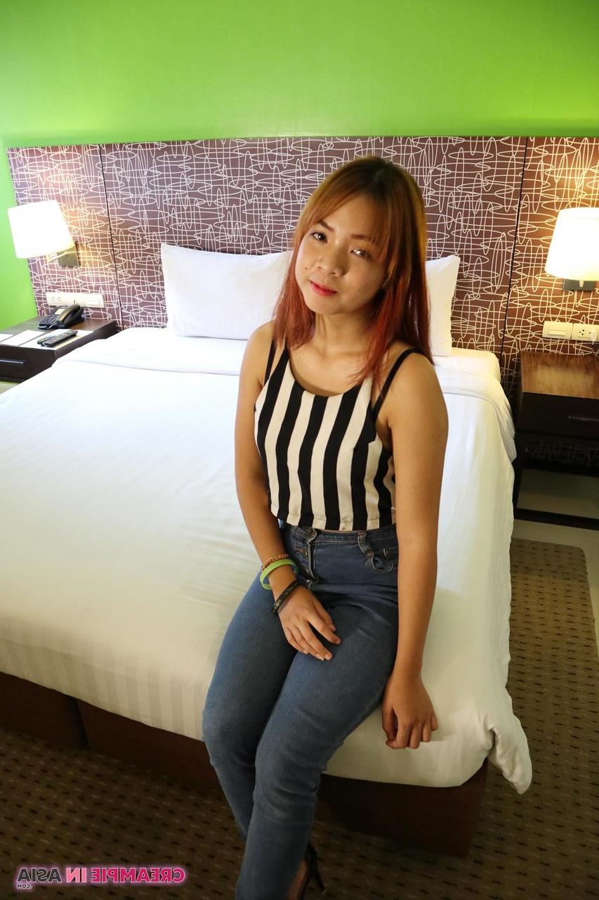 20P Cute Asian babe Muai strips to her heels & spreads her creamy pussy