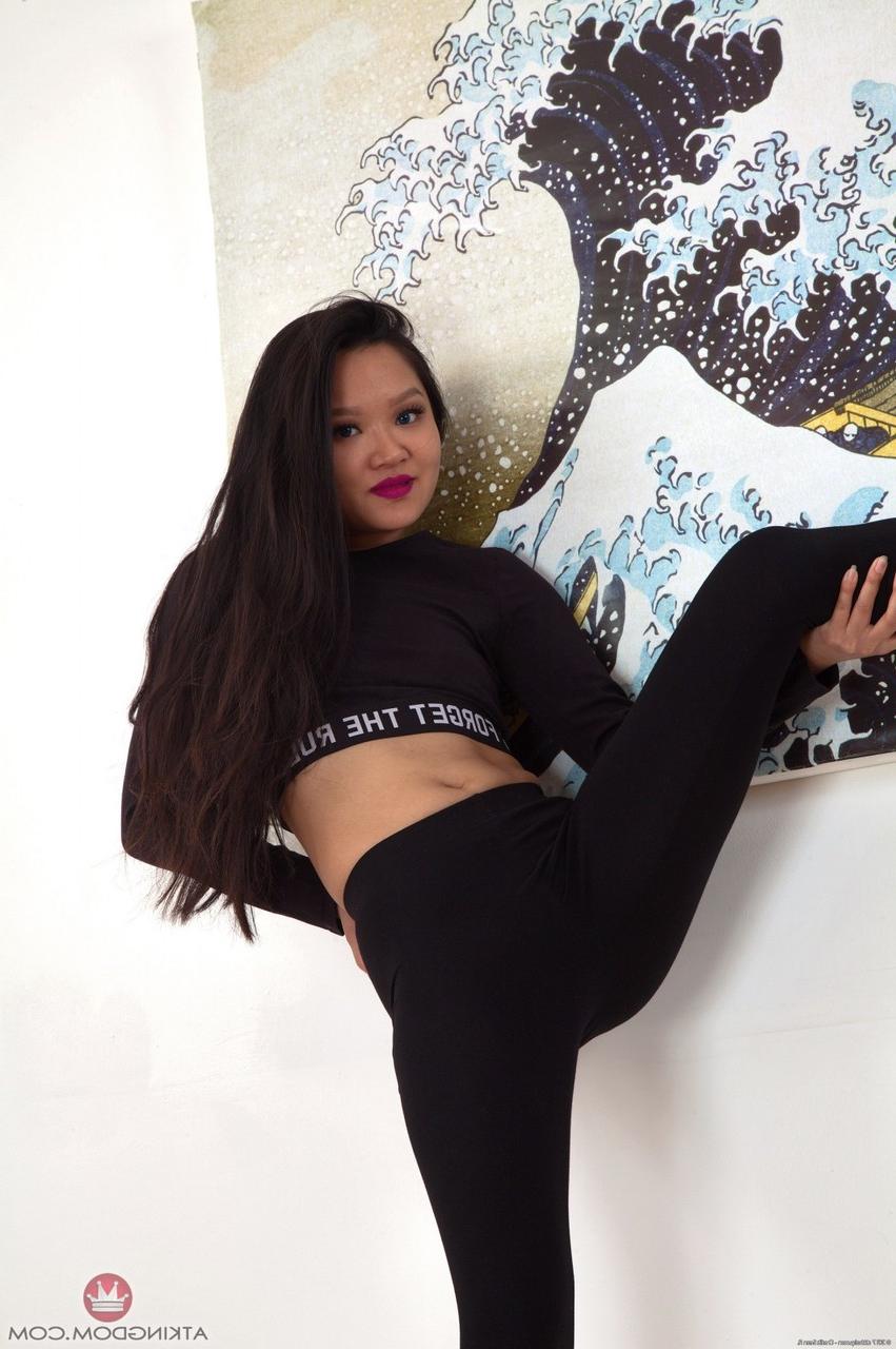 20P Skinny Asian brunette Louisa K spreads her legs and shows off her hairy pussy
