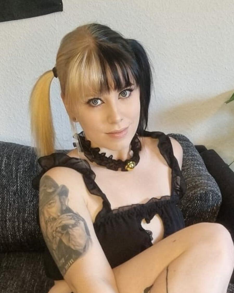 18P Glamorous tattooed amateur posing in a skimpy black outfit in a sexy solo