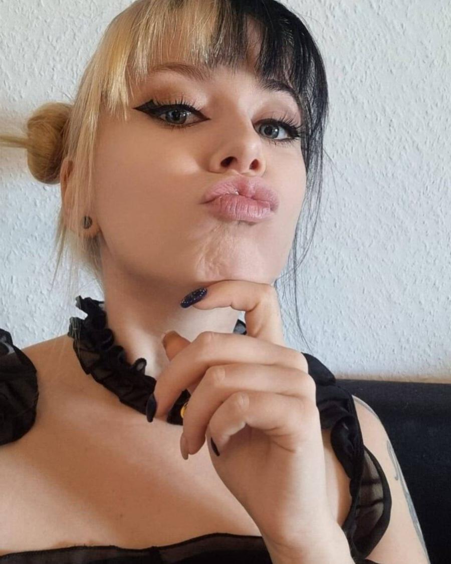 18P Glamorous tattooed amateur posing in a skimpy black outfit in a sexy solo