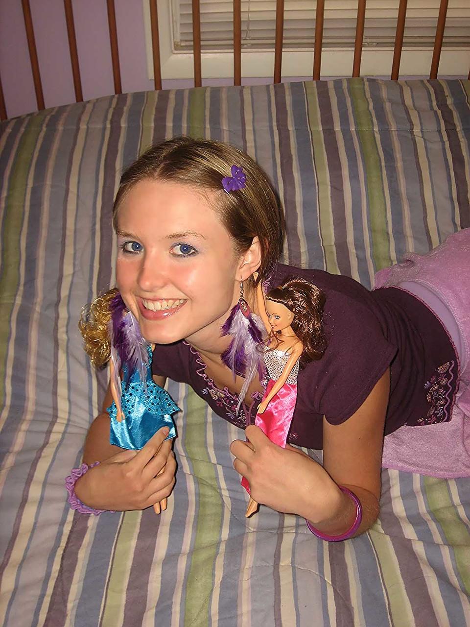 20P Cute brunette Kitty strips and toys herself after playing with Barbies