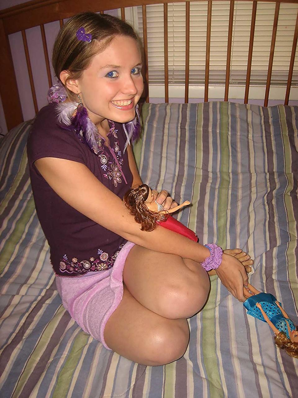 20P Cute brunette Kitty strips and toys herself after playing with Barbies