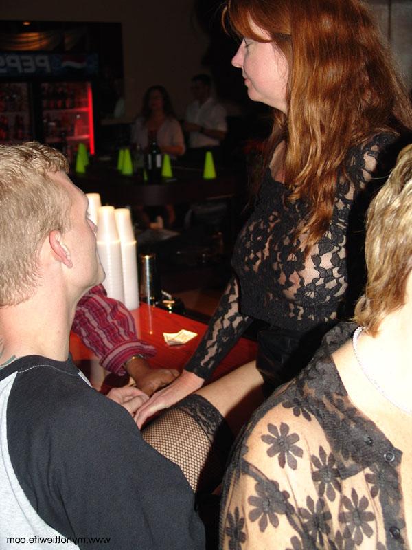 20P Sexy redheaded mature Double Dee gets naughty in a sexy skirt at a club