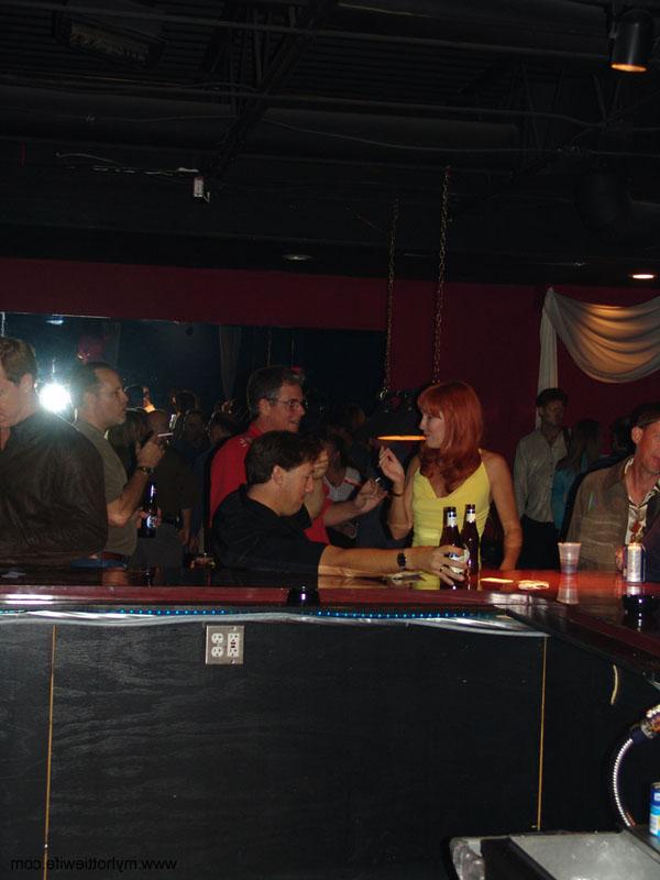 20P Sexy redheaded mature Double Dee gets naughty in a sexy skirt at a club