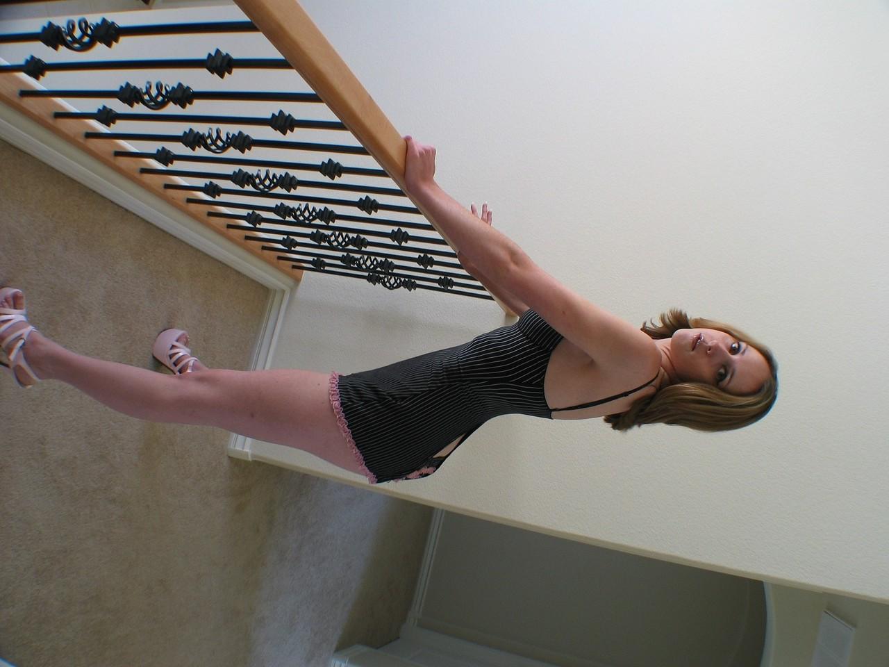 20P Blonde MILF Kelly Wells posing in her sexy lingerie & stripping on the stairs