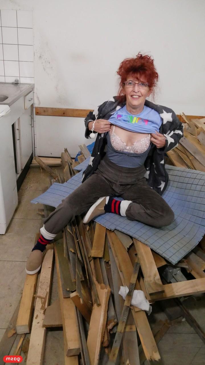 14P Redheaded granny with small tits takes a fat dick in her kitchen