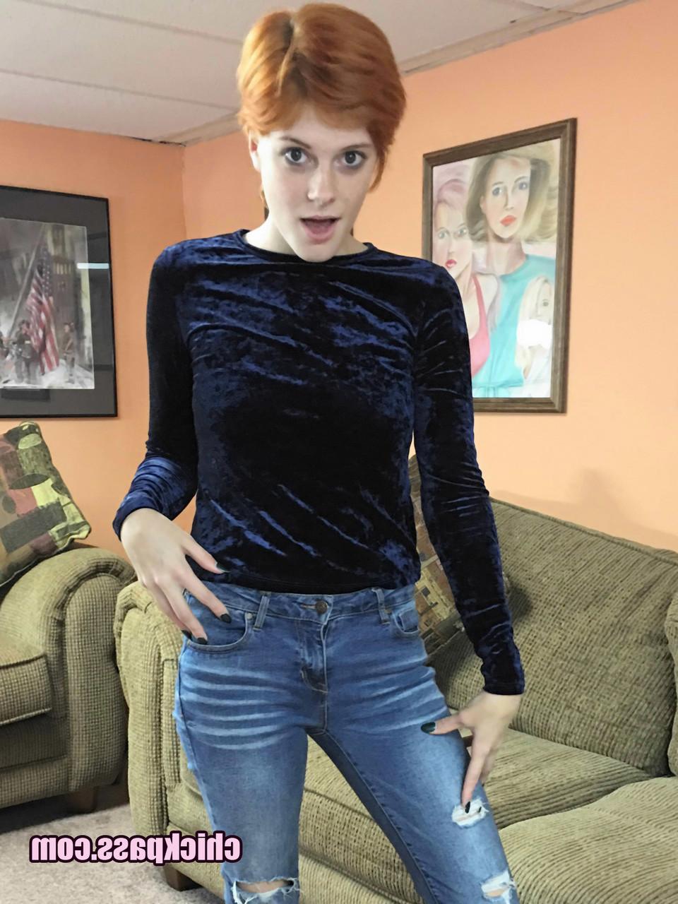 16P Short haired redhead Ava Little masturbates with a sex toy on the sofa