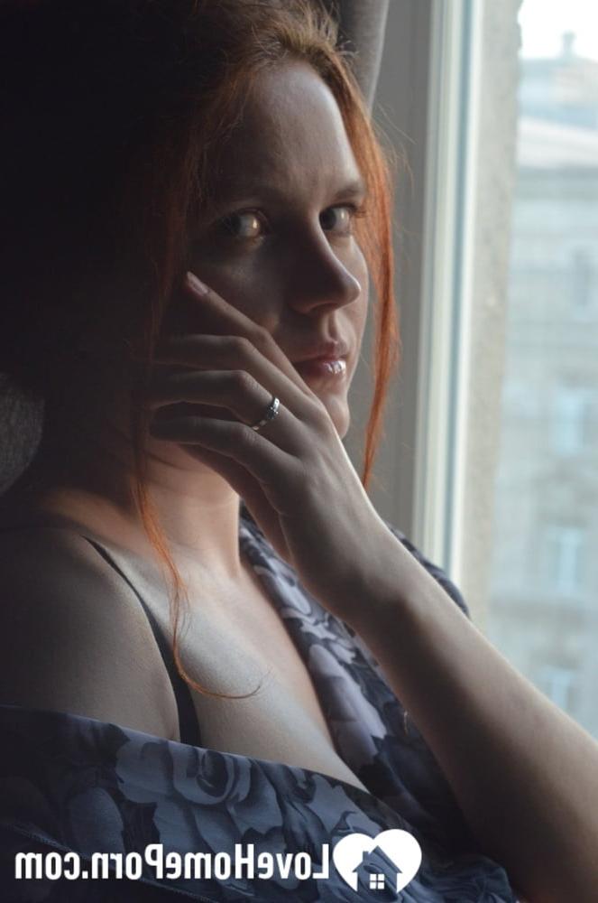 20P Redheaded amateur model strips by the window and touches her big juicy boobs