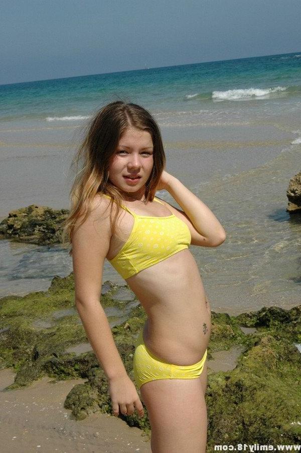 15P Charming 18 year old models a yellow bikini while at the beach