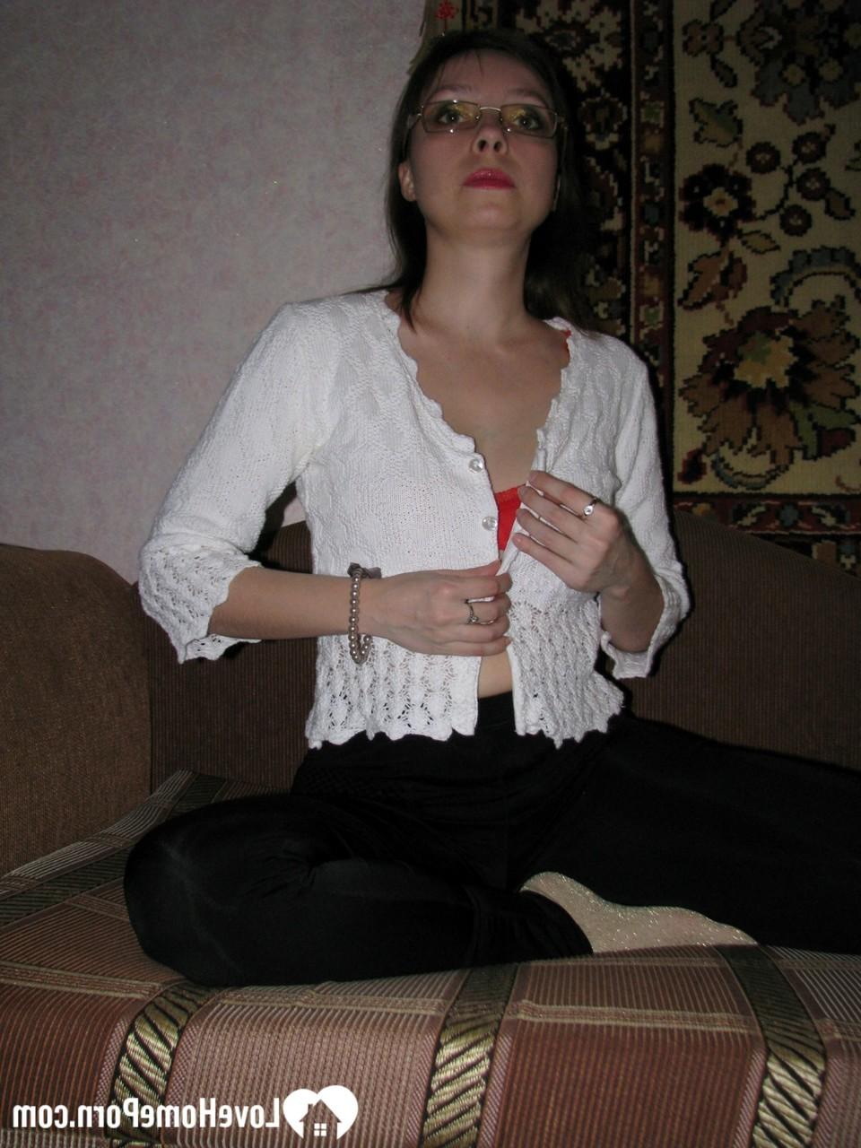 20P Dark-haired MILF strips to her socks and spreads her furry coochie