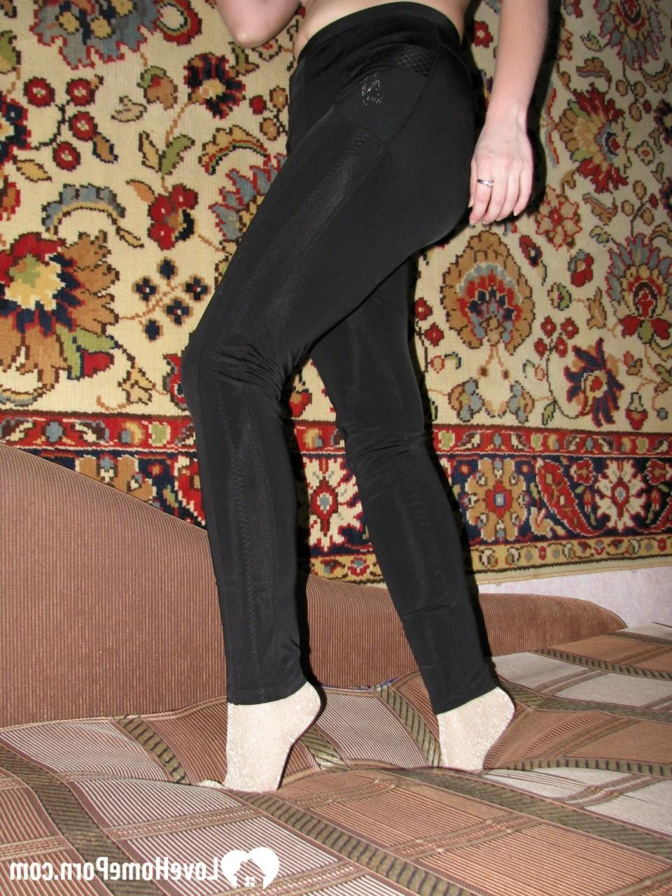20P Dark-haired MILF strips to her socks and spreads her furry coochie