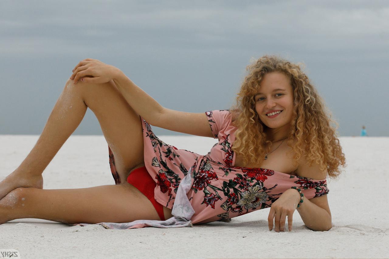 13P Curly haired babe Debra Kenlow flashes her tiny tits & her hot ass outdoors