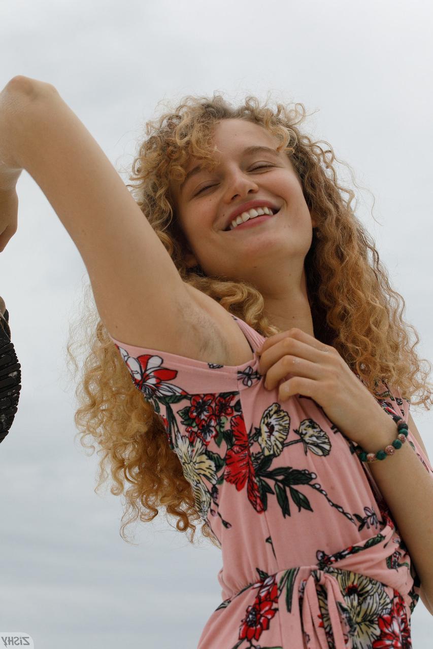 13P Curly haired babe Debra Kenlow flashes her tiny tits & her hot ass outdoors