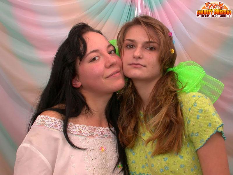 20P Young looking lesbians use a double ended dildo while having sex