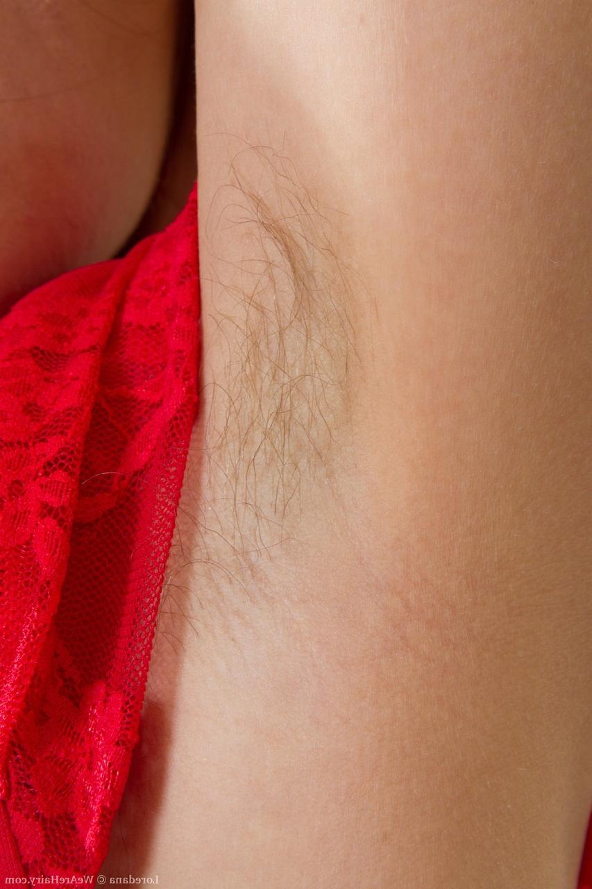 20P Caucasian solo girl in a red dress exposes her hairy body as she disrobes