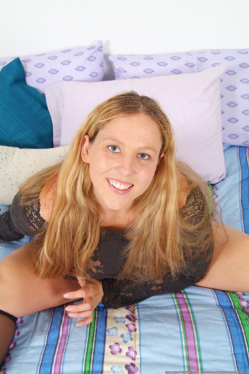 20P Chubby blonde Fiona spreads her trimmed pussy while stripping on her bed