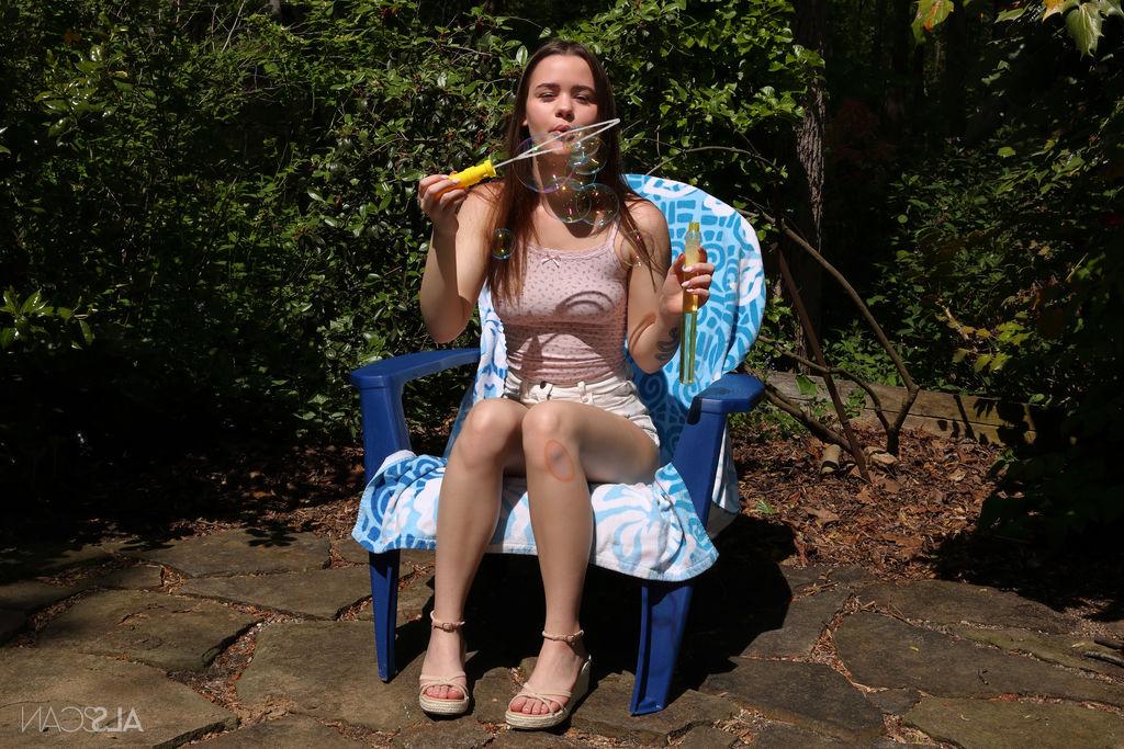 16P Horny teen Trinity Olsen pees on patio stones after vaginal insertions