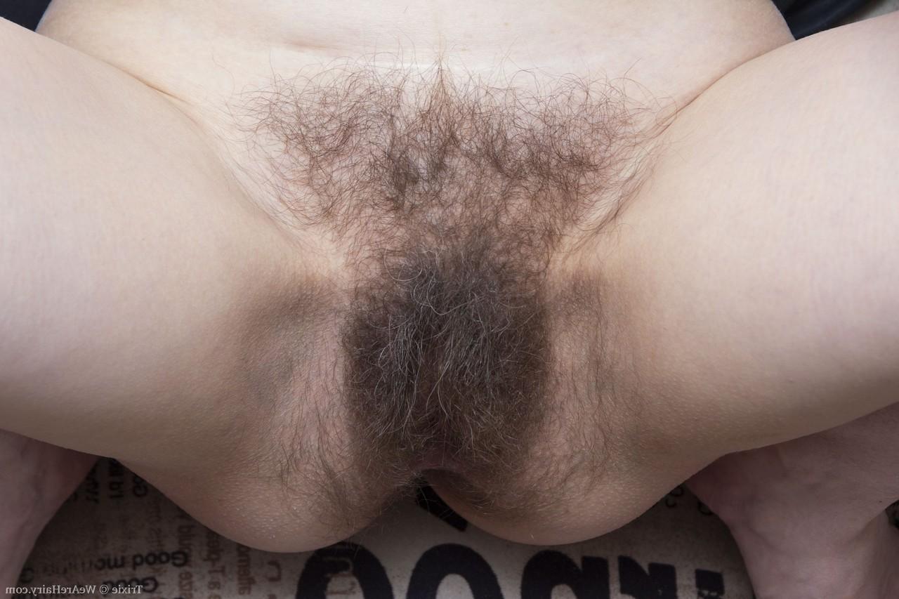 20P Mature American Trixie gets rid of her clothes and shows her furry crotch