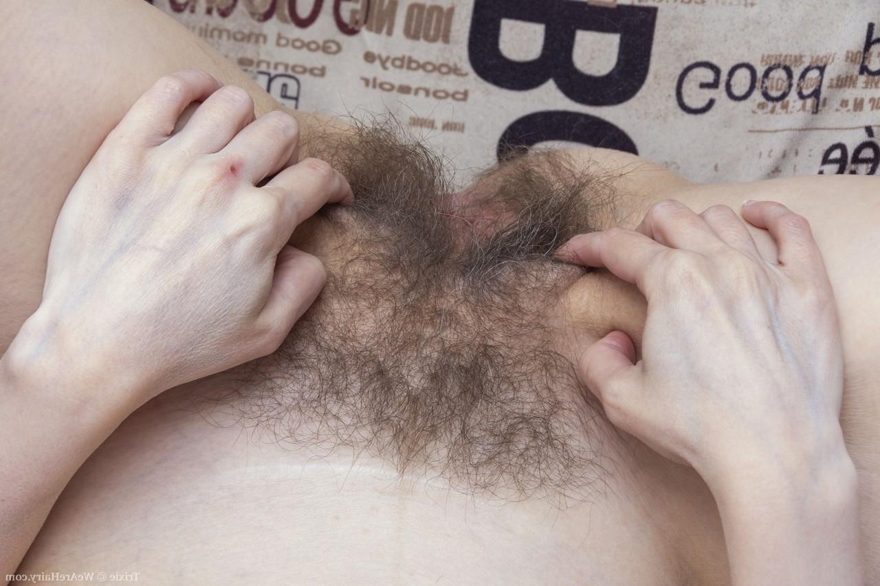 20P Mature American Trixie gets rid of her clothes and shows her furry crotch