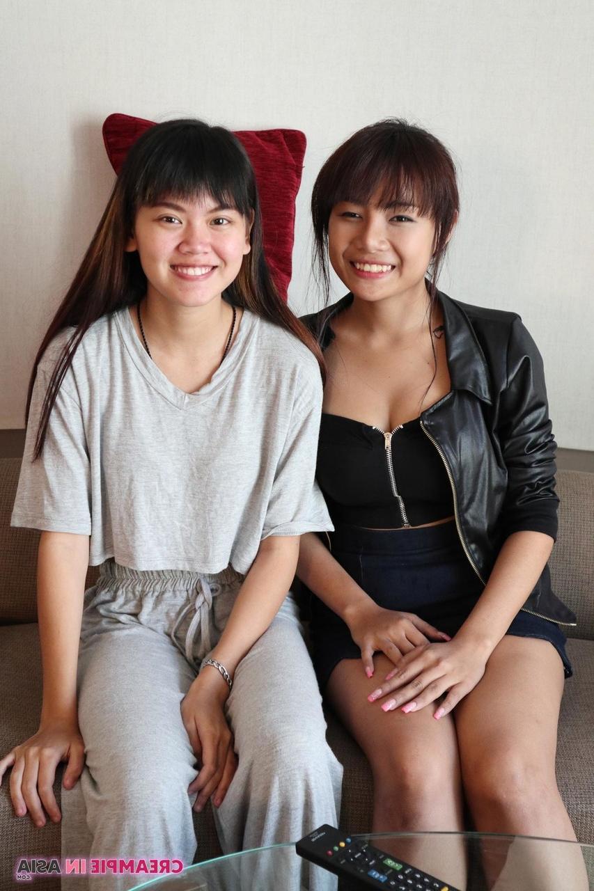 20P Petite Asian amateurs Sprite and Mon strip and pose naked together