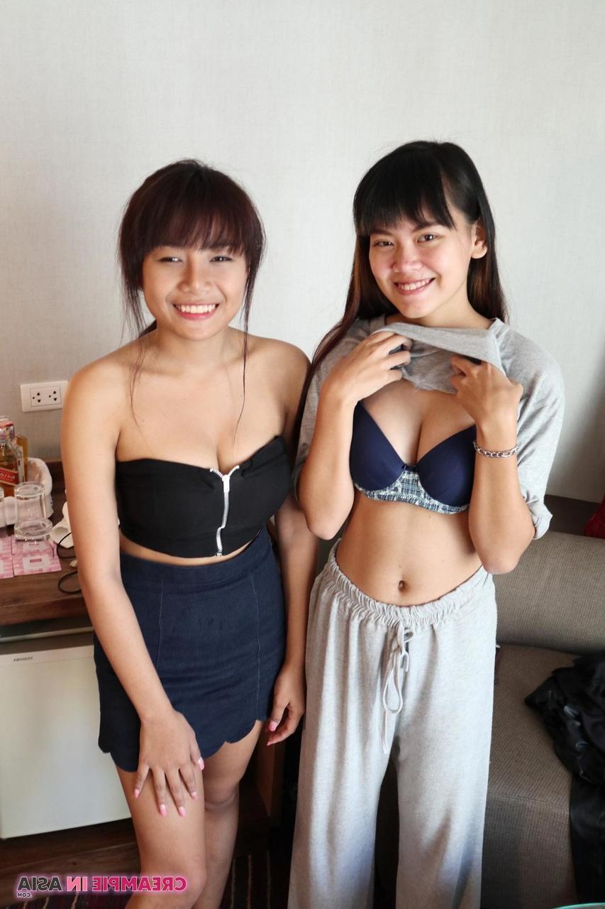 20P Petite Asian amateurs Sprite and Mon strip and pose naked together