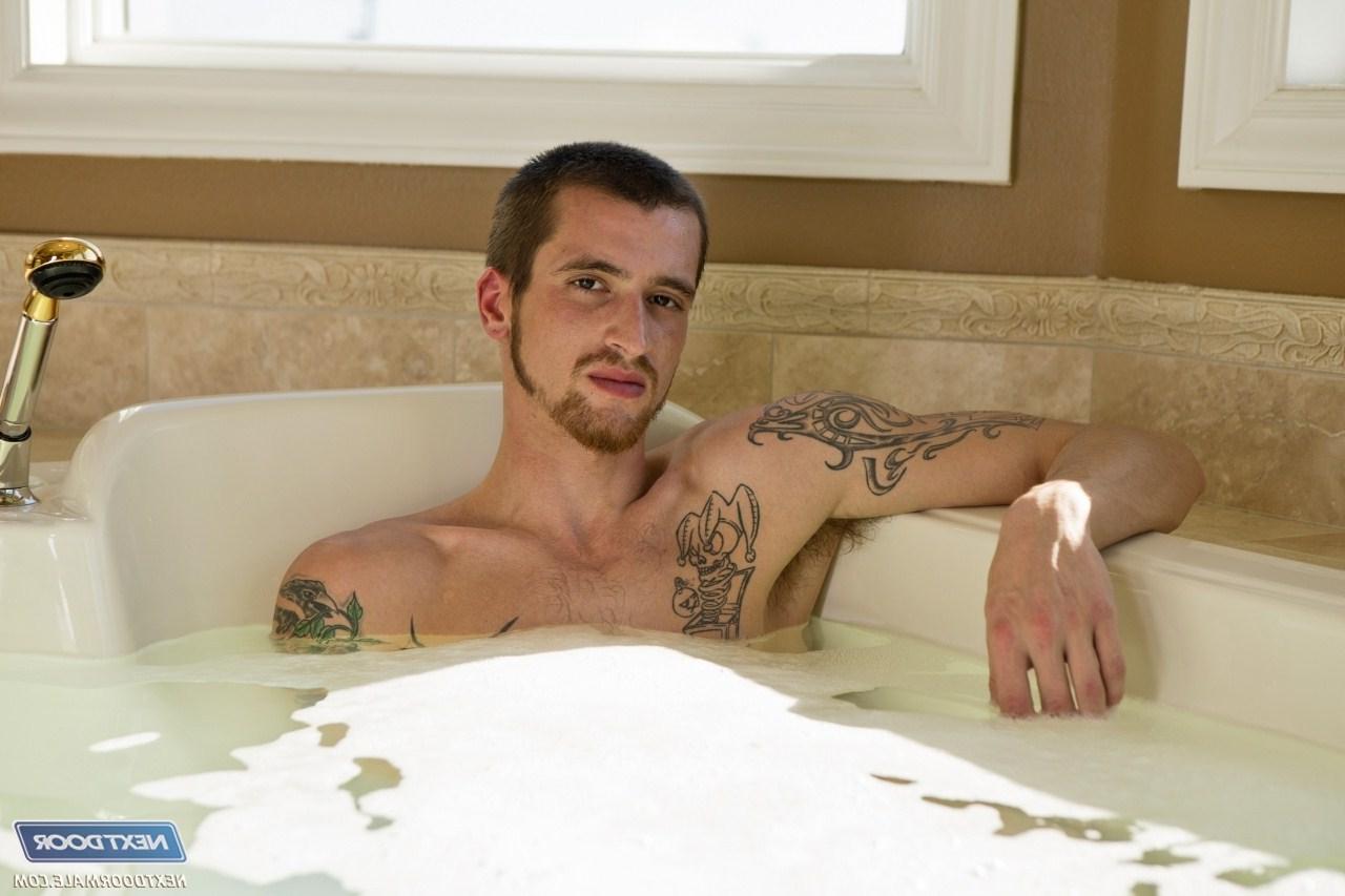 20P Tattooed jock Jake Riley strokes his cock & toys his asshole in the bathroom