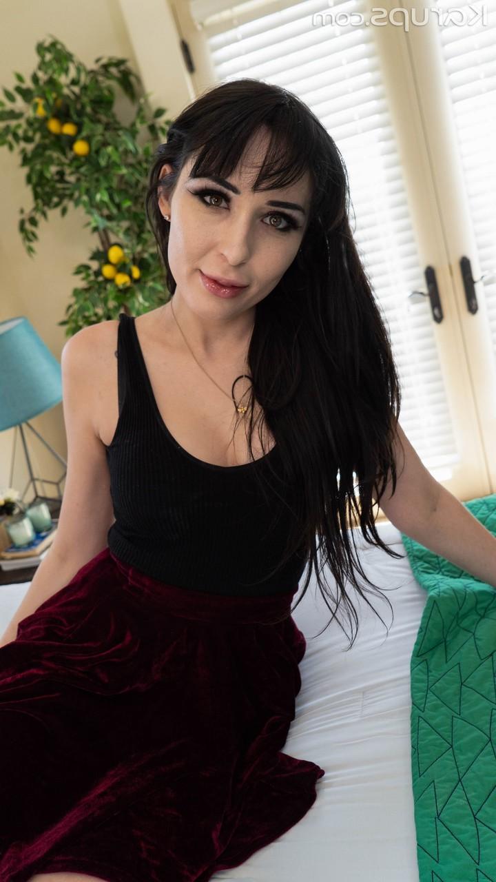 20P Raven-haired Estonian April Storm peels her dress off and shows her curves