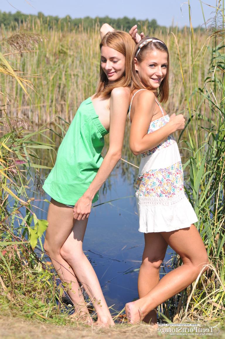 20P Young lesbians Nastya and Ashly get undressed atop a blanket on a dock