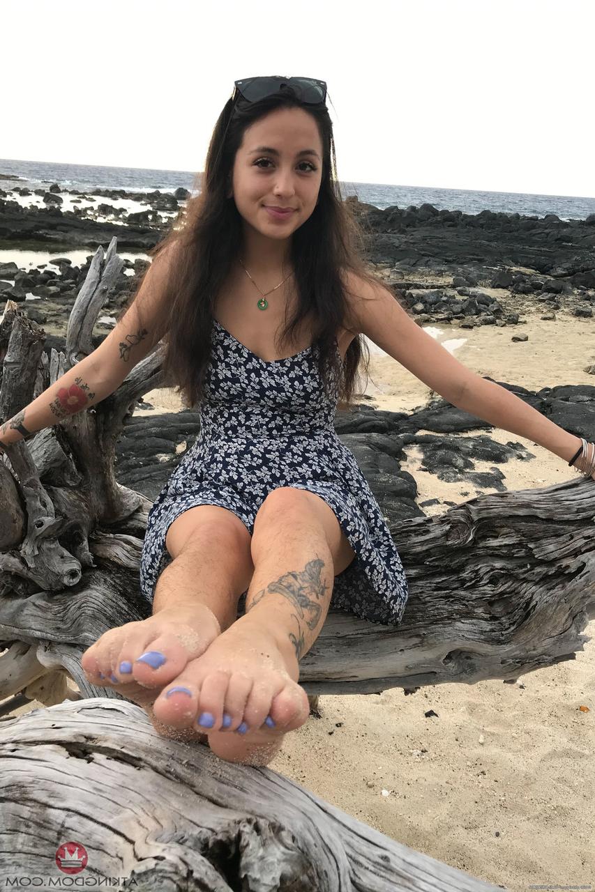 20P Teen Mi Ha Doan flashes her tits and exposes her hairy pussy on the beach