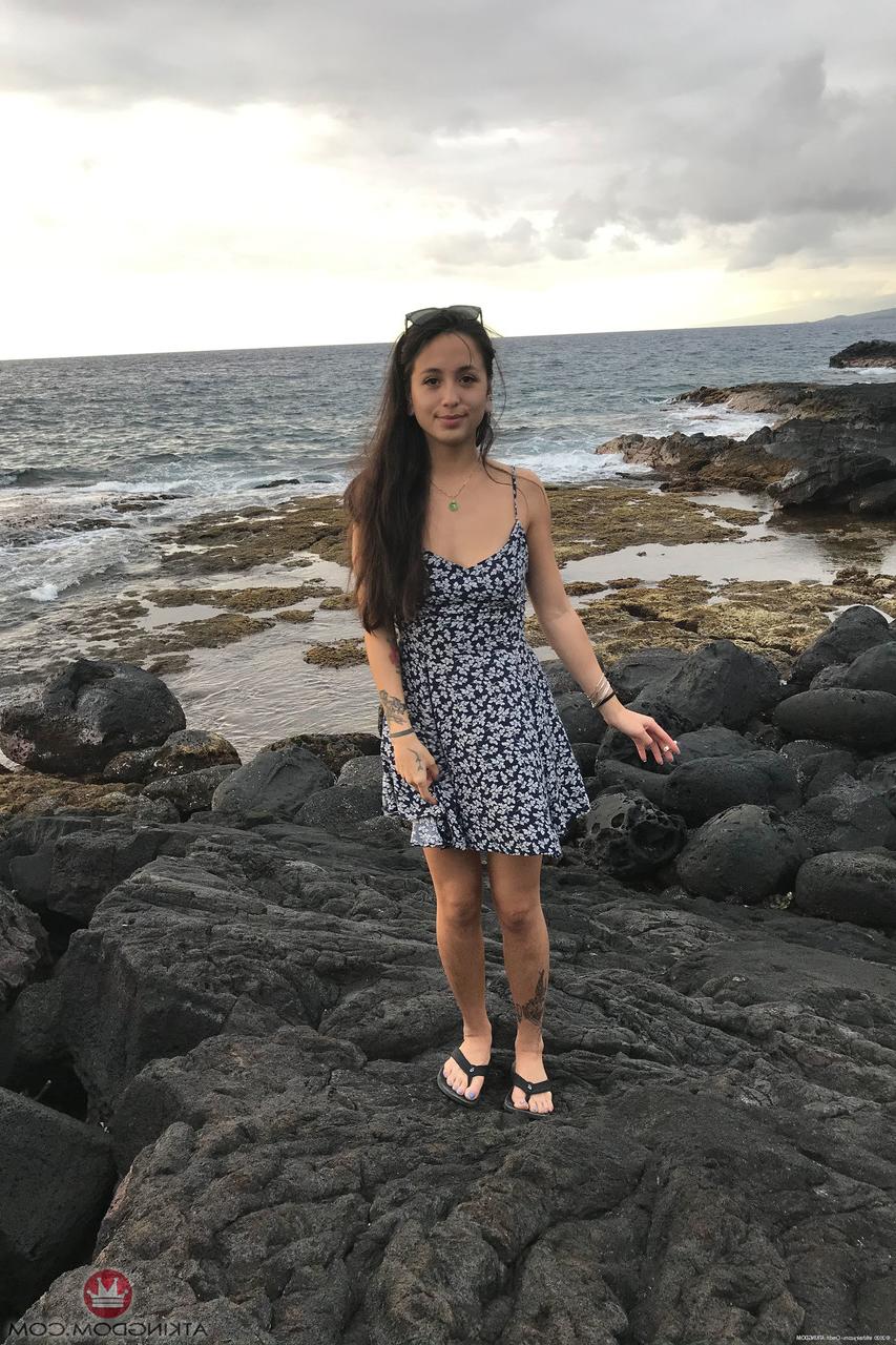 20P Teen Mi Ha Doan flashes her tits and exposes her hairy pussy on the beach