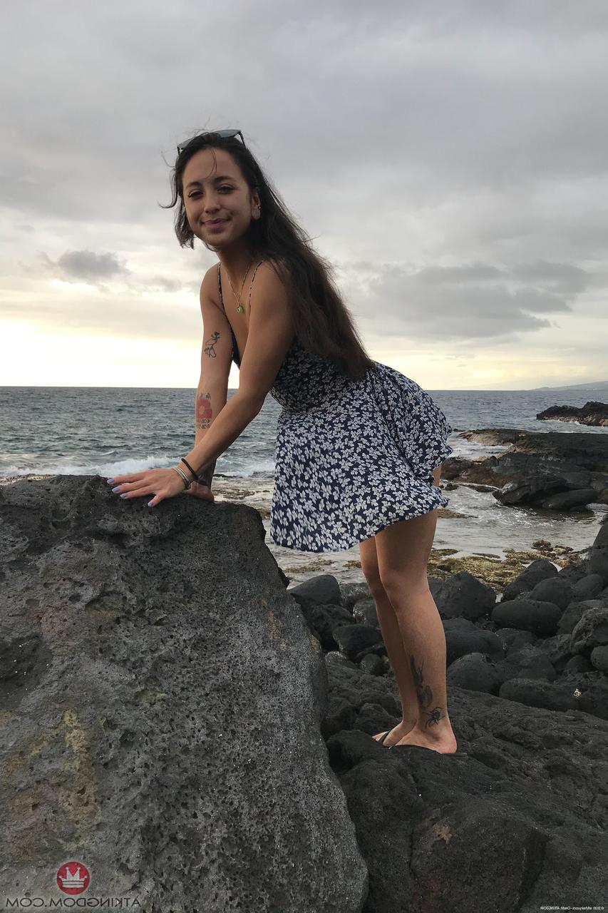 20P Teen Mi Ha Doan flashes her tits and exposes her hairy pussy on the beach